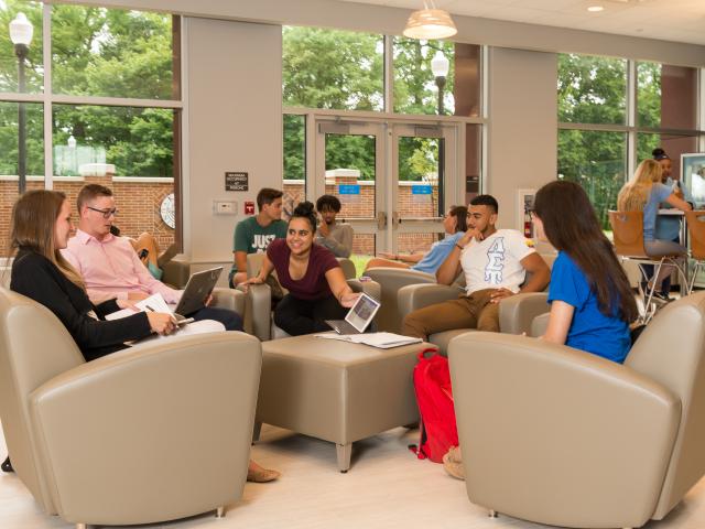 Resident student congregate in a lounge area